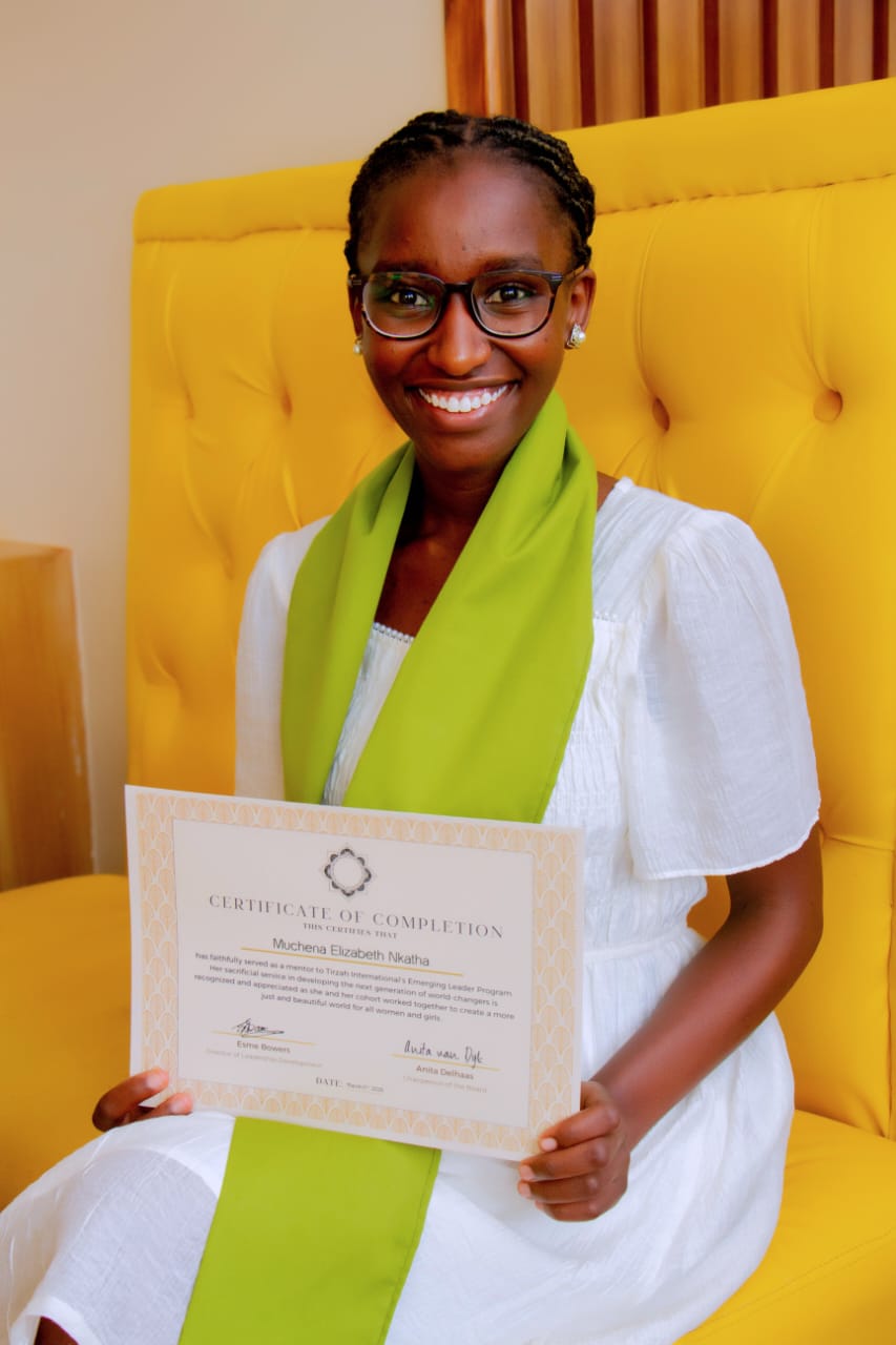 Liz with her certificate after completing a leadership program